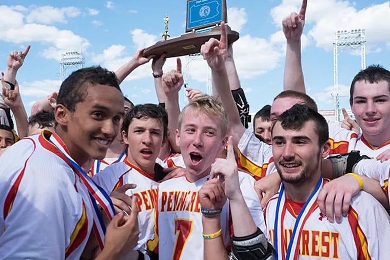 Penncrest celebrates with the trophy after its win. (Ed Hille/Staff Photographer)