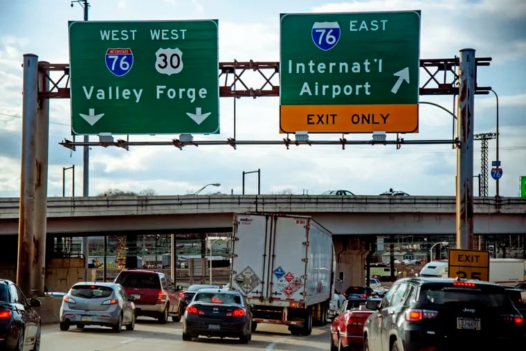 Coming off two lanes on I-676, the Vine Street Expressway,  trucks and cars merge into a single lane as they enter westbound I-76, the Schuylkill Expressway.