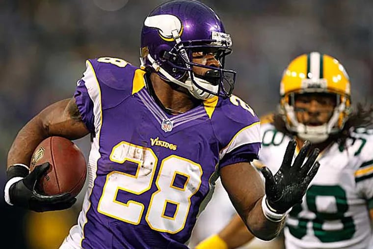 Vikings running back Adrian Peterson was the common denominator in countless fantasy championships. (Genevieve Ross/AP)