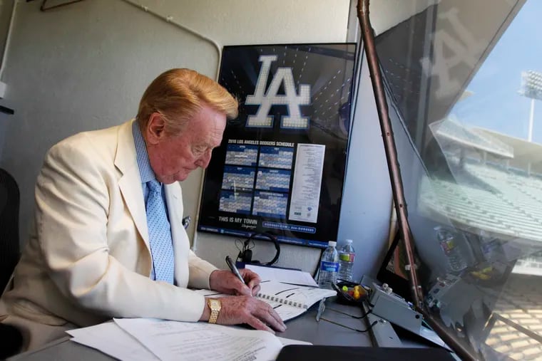 Vin Scully working in his booth at Dodger Stadium on Aug. 22, 2010.