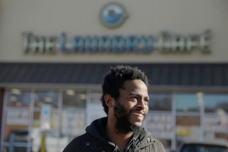 Adam McNeil, founder of SistaTalkPHL, in front of the Laundry Café at 901 W. Girard Avenue in North Philly, where he held one of his community wash days for Philly moms last year.