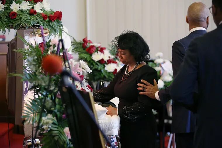 Rosalind Williams looks at her son Corey Michael Hadley before the casket is closed at the end of his viewing at Second Baptist Church of Germantown in Philadelphia on Saturday, Jan. 11, 2020. Hadley, a U.S. Army veteran, was 30 and suffering from post-traumatic stress disorder and depression when he took his own life Jan. 2.