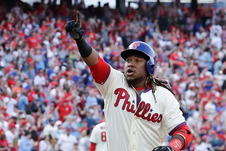 Maikel Franco points to fans after hitting a two-run fourth-inning home run against the Atlanta Braves on Saturday.