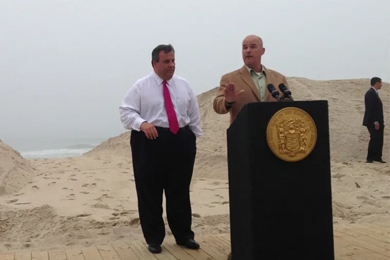 Gov. Christie stands behind Lavallette Mayor Walter LaCicero at the ceremony dedicating the completion of the new boardwalk to replace the one destroyed by Hurricane Sandy. PHOTO CREDIT: Amy S. Rosenberg/Staff