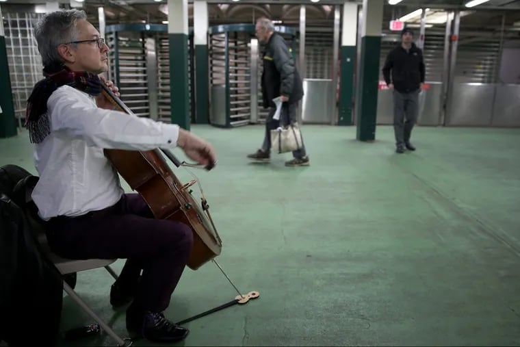 John Koen, a Philadelphia Orchestra cellist, plays at SEPTA’s Walnut-Locust subway station on March 23, 2018 as part of Bach in the Subways.
