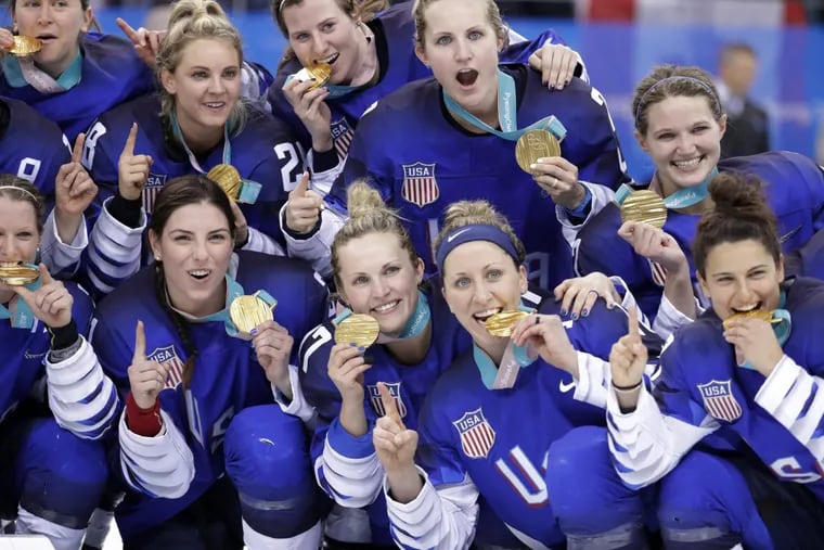 Untied States women’s hockey team players celebrate with their gold medals after beating Canada at the Pyeongchang Winter Olympics in South Korea.