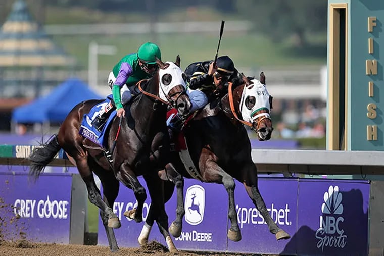 Hightail, right, ridden by Rajiv Maragh noses ahead of Merit Man (3), ridden by Patrick Valenzuela, at the wire to win the Juvenile Sprint horse race at the Breeders' Cup, Friday, Nov. 2, 2012, in Arcadia, Calif. (AP Photo/Jae C. Hong)
