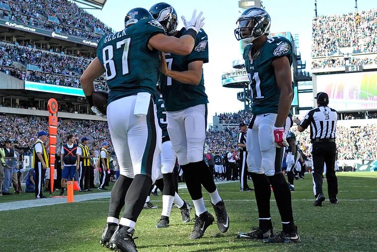 Philadelphia Eagles tight end Brent Celek (87) celebrates a 13-yard touchdown catch with quarterback Sam Bradford (7) and wide receiver Jordan Matthews (81) during the third quarter against the New Orleans Saints at Lincoln Financial Field.