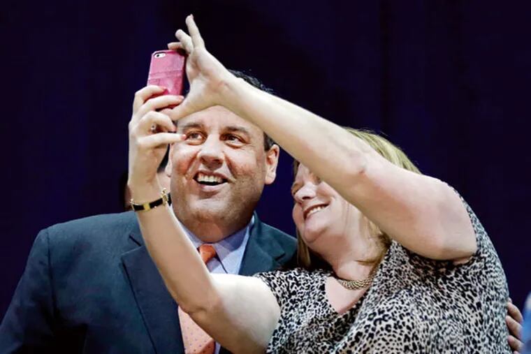 Gov. Chris Christie poses for a photograph before he spoke during a town hall Tuesday, April 7, 2015, in Matawan, N.J. (AP Photo/Mel Evans)