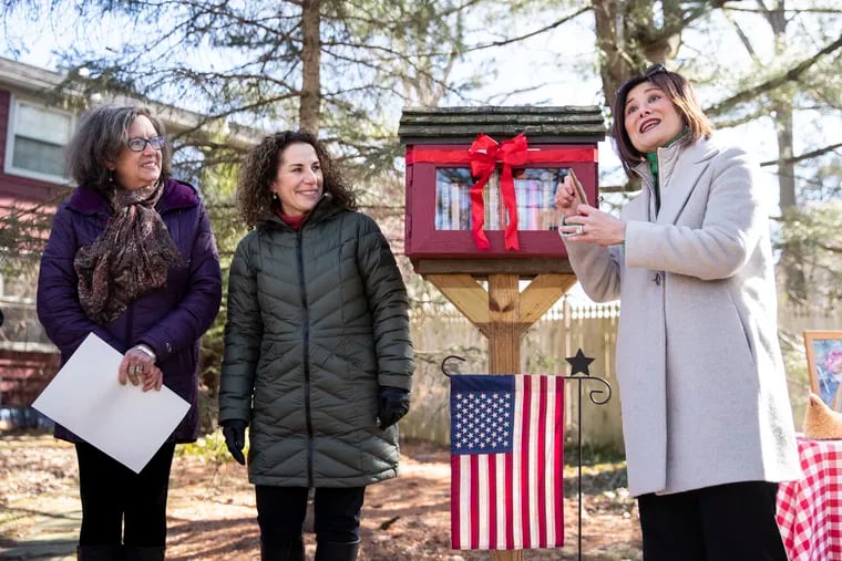 (left to right) Martha Wright, New Jersey Assemblywoman Pamela Lampitt, and Mayor Susan Shin Angulo, speak during the Little Free Library dedication in honor of the late Shaula C. Wright on Covered Bridge Road in Cherry Hill, N.J. on Sunday, February 20, 2022. Longtime Cherry Hill resident, Shaula C. Wright used to curate the collection in this Little Library.