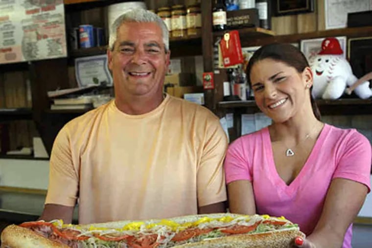 Primo's founder Richard Neigre with one of his daughters, Audrey.