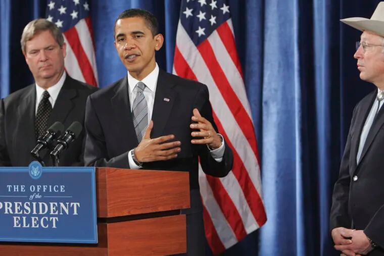 President-elect Barack Obama with cabinet choices Tom Vilsack (left) for Agriculture and Ken Salazar for Interior.