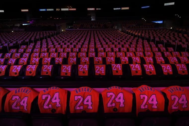 Kobe Bryant shirts adorn the Staples Center seats before a ceremony honoring the late Lakers star Friday in Los Angeles.