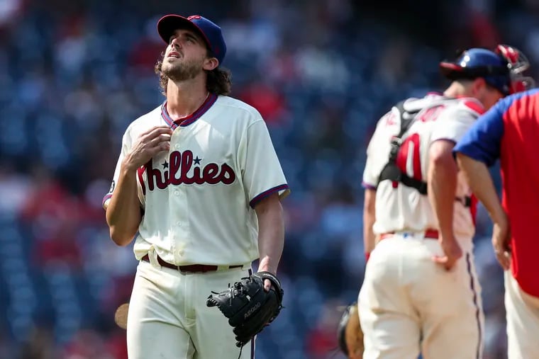 Phillies starting pitcher Aaron Nola gets pulled from the game during the sixth inning against the Colorado Rockies.