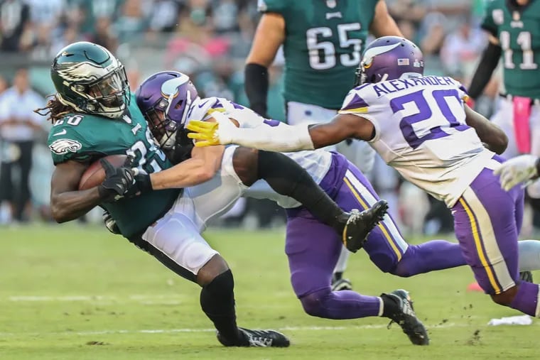 Jay Ajayi is tackled by the Vikings' Andrew Sendejo.