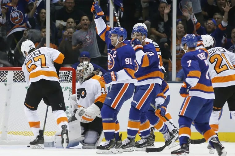 Islanders center John Tavares (91) celebrates after scoring against Flyers goalie Alex Lyon  in the second period