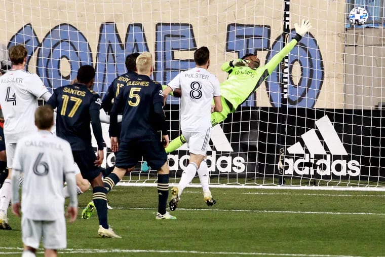 Union goalkeeper Andre Blake couldn't reach Adam Buksa's header that went in for New England's opening goal.
