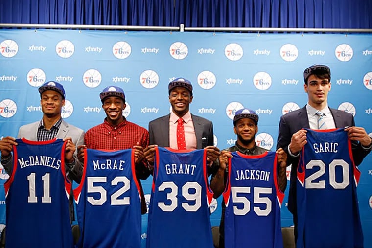 Newly-acquired and drafted Philadelphia 76ers' K.J. McDaniels, from left, Jordan McRae, Jerami Grant, Pierre Jackson, and Dario Saric pose for a photo after a basketball news conference at the team's practice facility, Saturday, June 28, 2014, in Philadelphia. (Matt Slocum/AP)