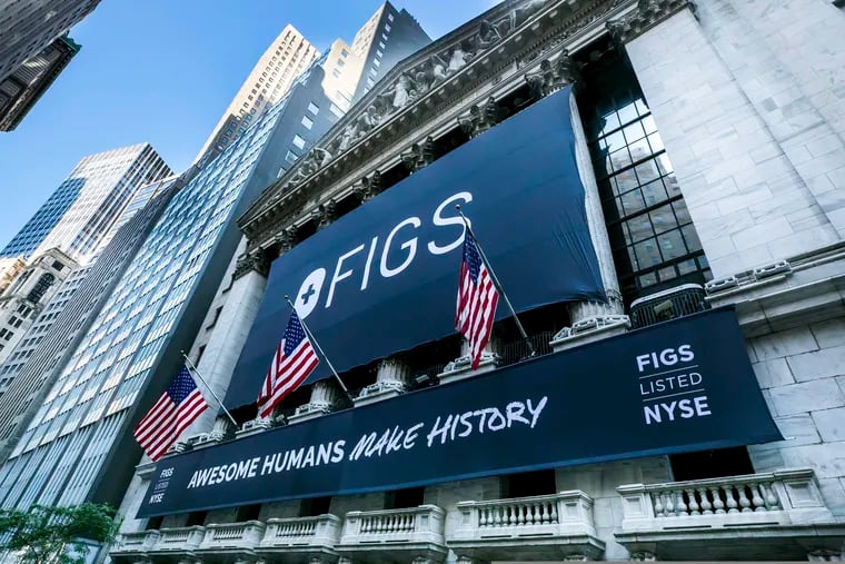 A banner for Figs hangs on the New York Stock Exchange last Thursday, noting the first day of trading for online scrubs seller Figs. Among its investors before the IPO was PSERS, the Pennsylvania Public School Employees' Retirement System.