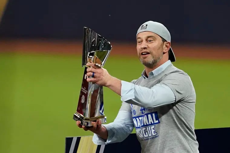 Los Angeles Dodgers president of baseball operations Andrew Friedman, here celebrating with the trophy after winning the National League Championship Series, is a great example for the Phillies.