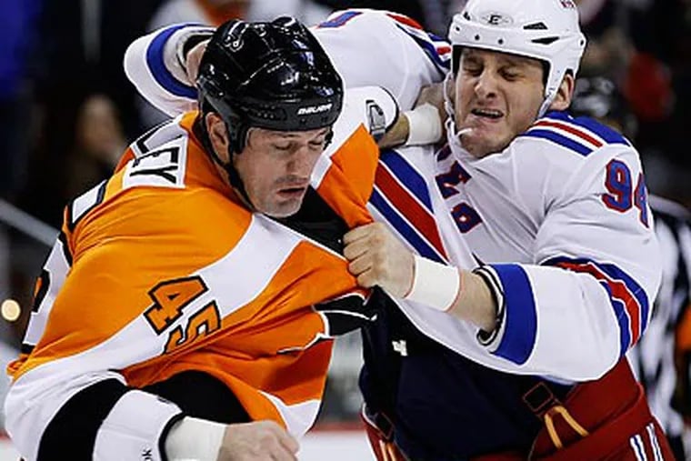 Derek Boogaard (right) died from an accidental overdose of alcohol and a pain-killing drug. (Matt Slocum/AP file photo)