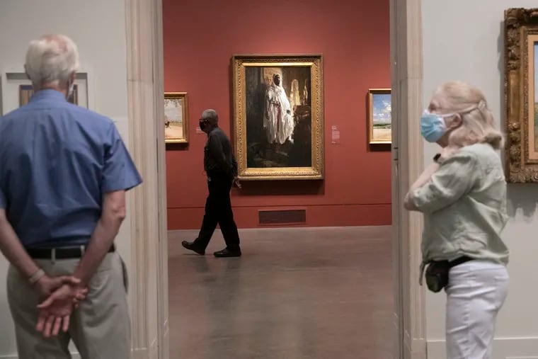 Visitors wear masks as they walk through the Philadelphia Museum of Art during a members' preview Sept. 3. The museum attracted 1,658 visitors Sept. 6 when it opened to the public on a pay-what-you-wish Sunday.