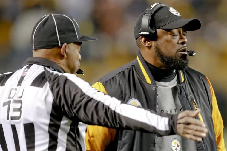 Pittsburgh Steelers head coach Mike Tomlin (right) thinks the wording of the “catch rule” needs to be revisited. (AP Photo/Keith Srakocic)