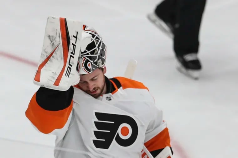 Flyers goalie Martin Jones comes off the ice during a break in the action against the Islanders during the third period at the UBS Arena in Elmont, NY, Tuesday,  January 25, 2022. Flyers losing streak is now 13 after dropping this one to the Islanders 4-3.