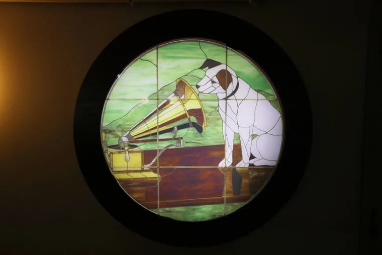 A stained glass replica of “Nipper” at the Victor Lofts in Camden. The dog was the symbol of the old Victor Talking Machine Company, whose old headquarters across from the Victor Lofts was used as the Camden school district’s offices and now is being sold to a developer.
