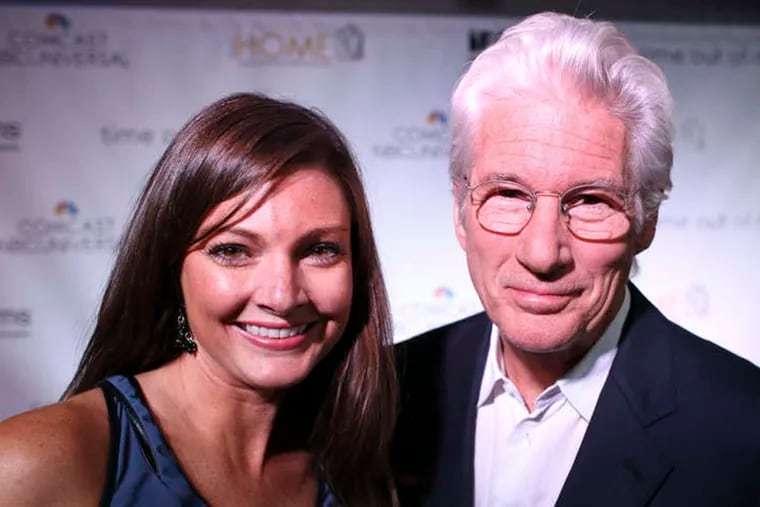 Philadelphia Daily News columnist Jenny DeHuff and Actor Richard Gere before a red carpet screening of "Time Out of Mind", Thursday Sept. 17, 2015, at the Ritz Theater in Philadelphia.
