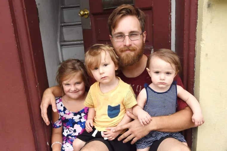 Michael Casner is shown with his three children, Isabella, left, Christian, second from left, and Peyton, right, Saturday Sept 1, 2018 in Spring City, Pa.