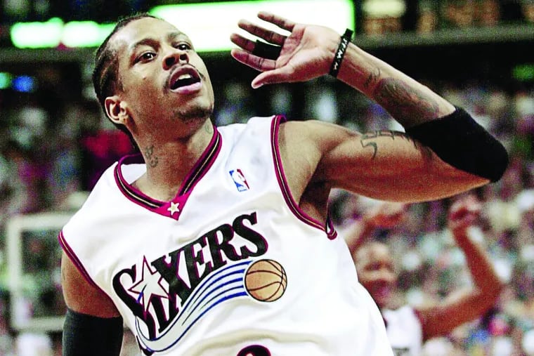 SIXR JUNE 3, 2001 — NBA PLAYOFFS EASTERN CONFERENCE FINALS GAME 7 — BUCKS at 76ERS–Sixers Allen Iverson listens for the roar of the crowd as he celebrates during the closing seconds of the Sixers 108 – 91 win over Milwaukee to capture the Eastern Conference Championship. PHOTO BY JERRY LODRIGUSS