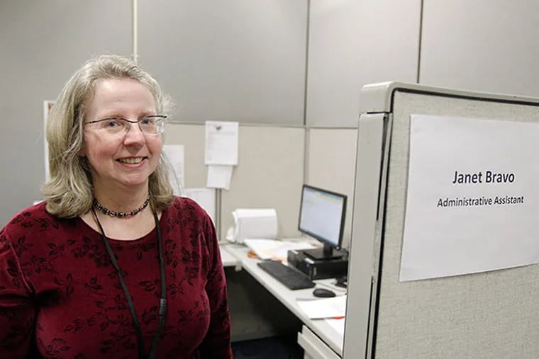 Janet Bravo, administrative assistant of Jewish Family Service of Atlantic County, stands by her cubicle. Jewish Family Services has been awarded the contract to serve as the intake for those in need. ( AKIRA SUWA  /  Staff Photographer )