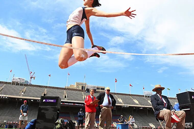 Villanova's Katherine Petruzzelis throws herself through the air during the long jump competition in the Penn Relays Women's Heptathlon. (Michael Bryant/Staff Photographer)