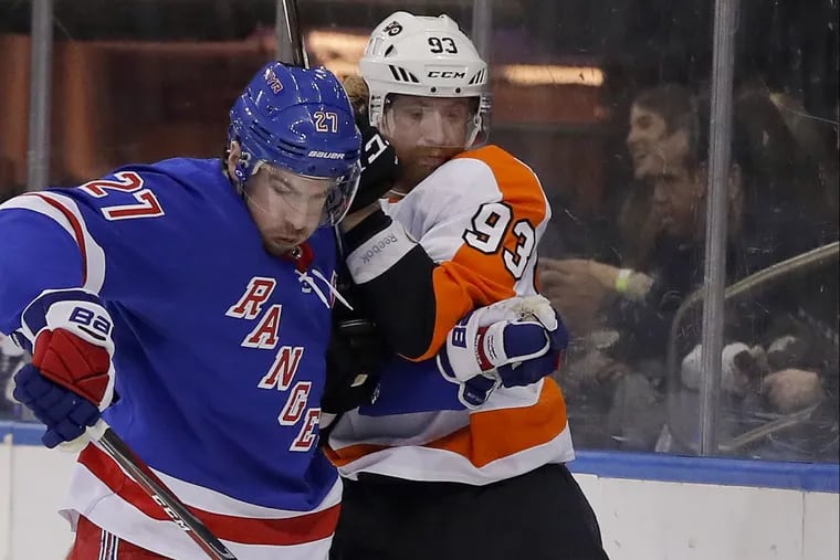 Rangers defenseman Ryan McDonagh and the Flyers’ Jake Voracek battling for the puck in New York’s 5-1 win Tuesday.