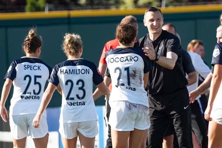 Reign FC manager Vlatko Andonovski (right) is the leading candidate to be the next head coach of the U.S. women's national team.