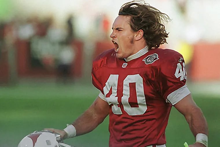 Cardinals safety Pat Tillman celebrates after tackling New Orleans Saints running back Lamar Smith for a loss in the third quarter in Tempe, Ariz., Sunday Dec. 20, 1998. The Cardinals won 19-17. (Roy Dabner/AP file)