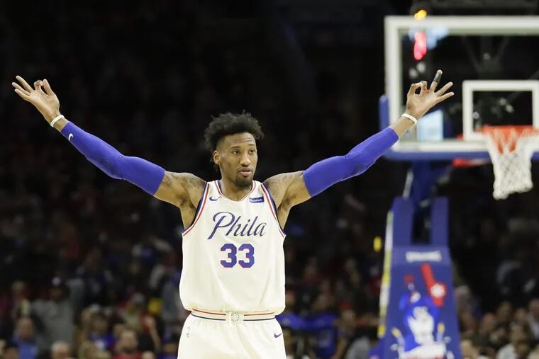 Robert Covington, shown here celebrating a three-pointer, is one of many Sixers who will be making their playoff debuts on Saturday.