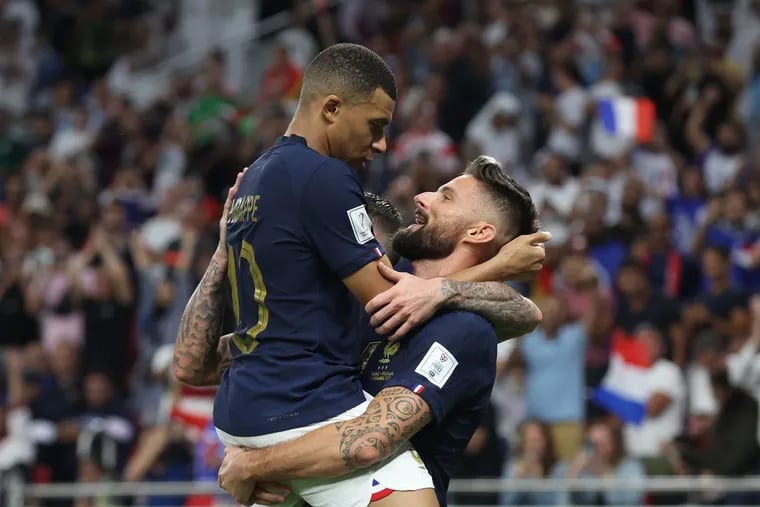 Olivier Giroud of France celebrates with teammate Kylian Mbappe after scoring the team's first goal during the FIFA World Cup Qatar 2022 Round of 16 match between France and Poland at Al Thumama Stadium on December 04, 2022 in Doha, Qatar. (Photo by Alex Grimm/Getty Images)
