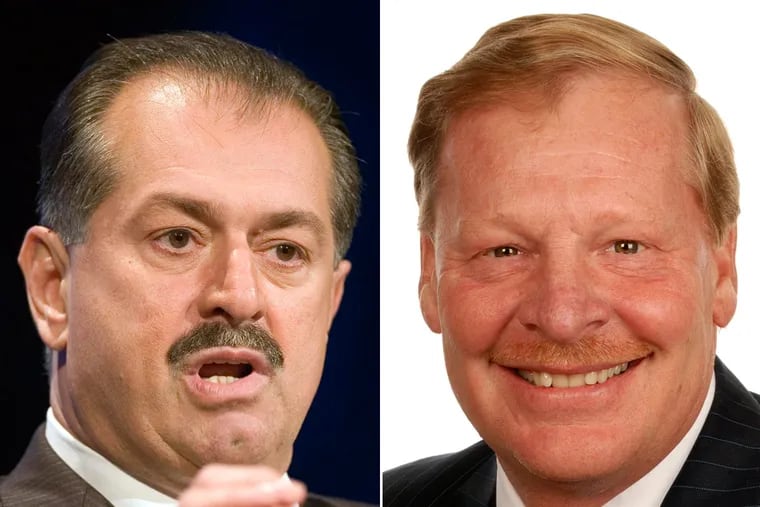 Dow Chemical Co. CEO Andrew Liveris (left) and DuPont Co. CEO Edward Breen.