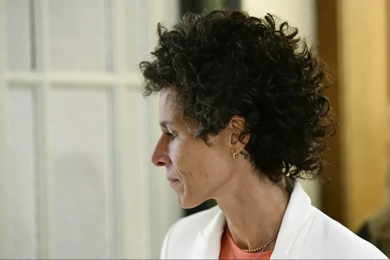 Andrea Constand walks while breaking for lunch during Bill Cosby’s sexual assault trial at the Montgomery County Courthouse on Friday, April 13, 2018, in Norristown, Pa. Constand, Bill Cosby’s chief accuser, is back on the witness stand Monday.