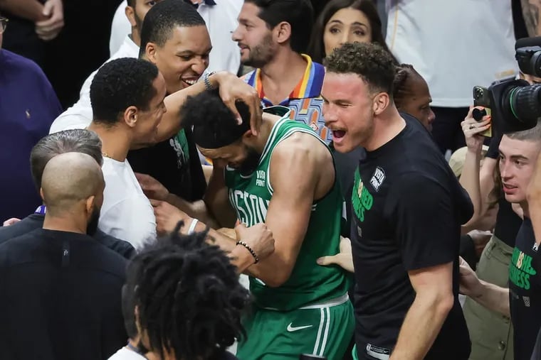 MIAMI, FLORIDA - MAY 27: Derrick White #9 and teammates react after defeating the Miami Heat 104-103 in game six of the Eastern Conference Finals at Kaseya Center on May 27, 2023 in Miami, Florida. (Photo by Megan Briggs/Getty Images)