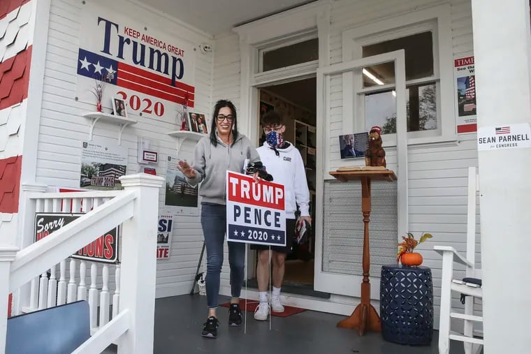 Marcy Templeton and her son Devin, 16 from Penn Township leave the "Trump House" with souvenirs in Latrobe, Pa.,Thursday, November 5, 2020