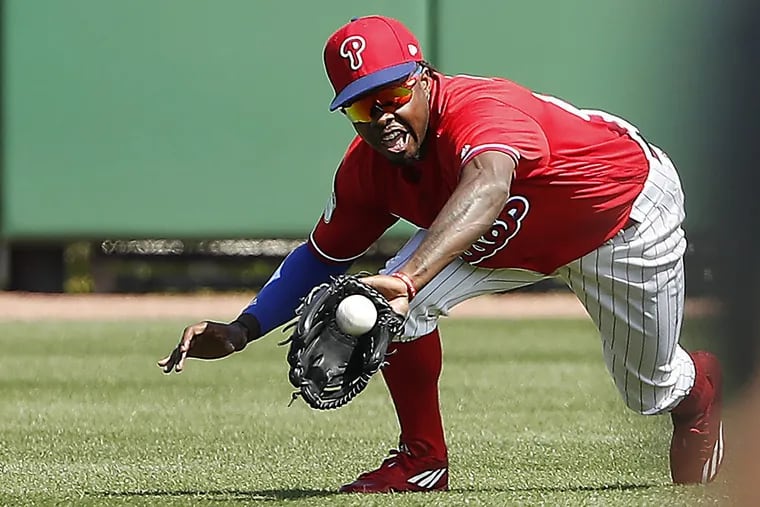 Phillies’ Roman Quinn reaches out to catch a ball in the 1st inning as the Phillies play University of Tampa at spring training in Clearwater, Fl on February 23, 2017.