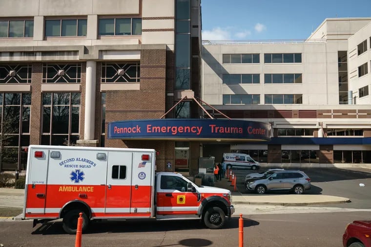 A file photograph shows an ambulance in front of Jefferson Abington Hospital's Pennock Emergency Trauma Center. A car struck and killed a woman crossing Old York Road heading in the direction of the hospital early Friday morning.