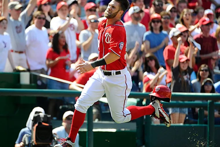 Washington Nationals right fielder Bryce Harper (34) scores a run against the Philadelphia Phillies during the seventh inning at Nationals Park. The Washington Nationals won 4-1. (Brad Mills/USA Today)