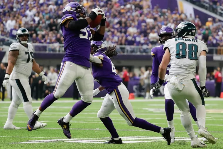 Minnesota Vikings defensive end Everson Griffen intercepts the football on an Eagles fake field goal past Eagles Dallas Goedert late in the second-quarter on Sunday, October 13, 2019 in Minneapolis.