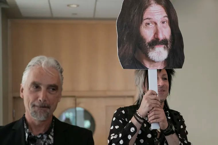 Bill Weston, left, program director WMMR, stands after taking a photo with a cardboard cutout of Pierre Robert (held by WMMR DJ Jacky Bam Bam, right), after a press conference announcing the latest class of honorees for The Philadelphia Music Alliance Walk of Fame on Wednesday, Aug. 07, 2019.