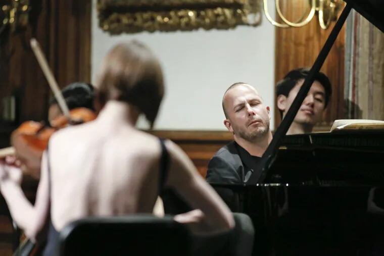 At the piano, Yannick Nezet-Seguin playing Brahms with musicians from the Philadelphia Orchestra at the College of Physicians in Philadelphia Wednesday night.