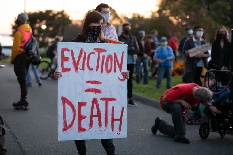 Housing activists gathered in front of Gov. Charlie Baker's house in Swampscott, Mass., in October. Renters are still being evicted during the coronavirus pandemic despite a federal order that is supposed to keep them in their homes.